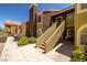 Exterior view of multi-story condos with well-maintained landscaping and private patios at 7950 W Flamingo Rd # 1024, Las Vegas, NV 89147