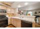 Kitchen overlooking dining area with breakfast bar and white tiled countertops at 7950 W Flamingo Rd # 1024, Las Vegas, NV 89147