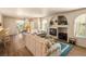 Spacious living room with wood floors, fireplace, and ample natural light at 7950 W Flamingo Rd # 1024, Las Vegas, NV 89147