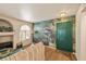 Comfortable living area with a waterfall mural and green front door at 7950 W Flamingo Rd # 1024, Las Vegas, NV 89147