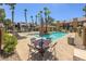 Enjoy the large community pool with comfortable lounge furniture and outdoor dining at 7950 W Flamingo Rd # 1024, Las Vegas, NV 89147