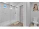 Clean, bright bathroom with glass-enclosed shower, toilet, and modern fixtures at 8072 Haywood Estate, Las Vegas, NV 89113
