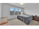Bedroom with three large windows, carpeted floor, and light-colored walls at 8072 Haywood Estate, Las Vegas, NV 89113