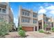 Contemporary three-story home featuring a garage and low-maintenance landscaping at 8072 Haywood Estate, Las Vegas, NV 89113