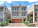 Contemporary three-story home featuring a garage and low-maintenance landscaping at 8072 Haywood Estate, Las Vegas, NV 89113