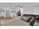 Inviting living room with stylish decor, comfortable seating, and functional desk area at 8072 Haywood Estate, Las Vegas, NV 89113