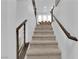 Carpeted staircase with modern railings leading to the upper level of the home at 8072 Haywood Estate, Las Vegas, NV 89113