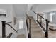 Bright staircase featuring neutral carpet, modern railing design, and natural light at 8072 Haywood Estate, Las Vegas, NV 89113