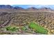 Aerial view of a community park with playground, basketball court, and community pool in Summerlin, Las Vegas at 818 Calluna St, Las Vegas, NV 89138