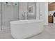 Close-up of modern standalone bathtub with glass shower and tiled walls at 818 Calluna St, Las Vegas, NV 89138