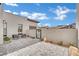 Serene courtyard featuring contemporary seating and sleek pavers, ideal for enjoying the outdoors privately at 818 Calluna St, Las Vegas, NV 89138