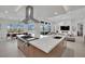 Open-concept kitchen boasts a large island, modern appliances, and bright, airy dining area at 818 Calluna St, Las Vegas, NV 89138