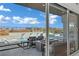 Relaxing patio overlooking a modern pool area with cascading water features and comfortable seating for outdoor enjoyment at 818 Calluna St, Las Vegas, NV 89138