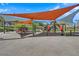 A vibrant playground with colorful slides, swings, and play areas providing a fun and engaging space for  at 818 Calluna St, Las Vegas, NV 89138