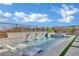 Relaxing pool area with in-pool loungers, spa, and lush landscaping for a serene backyard oasis at 818 Calluna St, Las Vegas, NV 89138