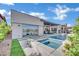 Backyard showcasing a pool, spa, outdoor dining area, and modern home design at 818 Calluna St, Las Vegas, NV 89138