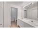 Bathroom featuring double sinks, white cabinetry, and tiled floor at 900 Heavenly Hills Ct # 114, Las Vegas, NV 89145