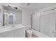 White bathroom featuring a shower, vanity, mirror, tile flooring, and neutral walls at 900 Heavenly Hills Ct # 114, Las Vegas, NV 89145
