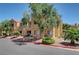 Apartment building exterior with lush landscaping, sidewalks and mature shade trees at 900 Heavenly Hills Ct # 114, Las Vegas, NV 89145