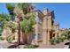 Exterior view of a well maintained apartment complex building with stucco finish at 900 Heavenly Hills Ct # 114, Las Vegas, NV 89145