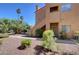 A well maintained exterior with private entrance, mature landscaping, and stucco siding at 900 Heavenly Hills Ct # 114, Las Vegas, NV 89145