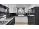 Clean kitchen features appliances, granite countertops, white cabinetry, and a window at 900 Heavenly Hills Ct # 114, Las Vegas, NV 89145