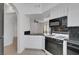 Open concept kitchen with a view to the living room, neutral walls and tile floors at 900 Heavenly Hills Ct # 114, Las Vegas, NV 89145