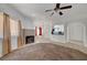 Bright living room features a fireplace, neutral paint, carpet, and tile flooring at 900 Heavenly Hills Ct # 114, Las Vegas, NV 89145