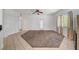 Spacious living room with carpeting and large window at 900 Heavenly Hills Ct # 114, Las Vegas, NV 89145