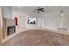 Spacious living room featuring a fireplace, neutral walls, carpet, and tile floors at 900 Heavenly Hills Ct # 114, Las Vegas, NV 89145