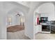 Open concept living space featuring an arched entryway to the kitchen and living room at 900 Heavenly Hills Ct # 114, Las Vegas, NV 89145