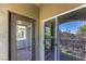 Balcony providing relaxing space with adjacent door and windows at 9050 W Warm Springs Rd # 2062, Las Vegas, NV 89148