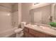 Bright bathroom features a tub/shower combo, spacious vanity, and wood-look flooring at 9050 W Warm Springs Rd # 2062, Las Vegas, NV 89148