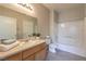 The bathroom offers a tub/shower combo, vanity, and wood-look flooring at 9050 W Warm Springs Rd # 2062, Las Vegas, NV 89148