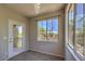 Bright bedroom with large windows offering outdoor views and balcony access at 9050 W Warm Springs Rd # 2062, Las Vegas, NV 89148