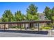 Exterior of building with carports and verdant landscaping at 9050 W Warm Springs Rd # 2062, Las Vegas, NV 89148
