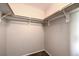 Walk in closet provides ample storage space, rods and carpeted floor at 9050 W Warm Springs Rd # 2062, Las Vegas, NV 89148