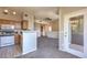 Galley kitchen with breakfast bar open to a living area and balcony access at 9050 W Warm Springs Rd # 2062, Las Vegas, NV 89148