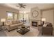 Inviting living room with a fireplace, a ceiling fan, and a balcony access at 9050 W Warm Springs Rd # 2062, Las Vegas, NV 89148