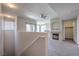 Bright living room with cozy fireplace, neutral carpet, and access to a private balcony at 9050 W Warm Springs Rd # 2062, Las Vegas, NV 89148