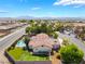 Aesthetic desert home featuring a sparkling pool, putting green, spacious yard, and stunning mountain views at 9385 Mohawk St, Las Vegas, NV 89139