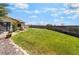 A large grassy backyard has ample room for outdoor activities and entertaining with mature landscaping at 9385 Mohawk St, Las Vegas, NV 89139