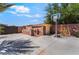 Well-equipped backyard featuring a built-in barbecue, basketball hoop, and flowering bushes at 9385 Mohawk St, Las Vegas, NV 89139