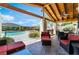 Backyard patio features an outdoor kitchen, dining area, pool, spa, and comfortable seating at 9385 Mohawk St, Las Vegas, NV 89139
