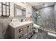 Bathroom with a modern vanity, mirror, and glass shower featuring modern finishes at 9385 Mohawk St, Las Vegas, NV 89139