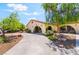 Well-manicured yard with drought resistant landscaping and a spacious driveway at 9385 Mohawk St, Las Vegas, NV 89139