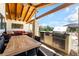 Beautiful backyard patio with an outdoor kitchen, dining table, and cozy seating area at 9385 Mohawk St, Las Vegas, NV 89139