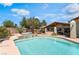 An inviting pool and spa offer a relaxing backyard oasis with ample seating and a tranquil water feature at 9385 Mohawk St, Las Vegas, NV 89139