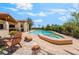 An inviting pool and spa combination offers a relaxing backyard oasis, with ample patio space at 9385 Mohawk St, Las Vegas, NV 89139