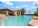 Sparkling pool with a spa offers a tranquil backyard retreat complete with loungers and a basketball court at 9385 Mohawk St, Las Vegas, NV 89139